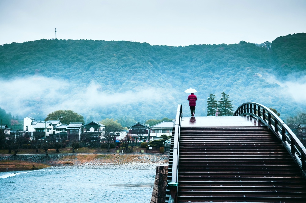 Kintaikyo historic bridge on rainy day in Iwakuni town, Yamaguchi, Japan